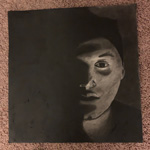 This image is of an art piece that is painted in black and white colors. 