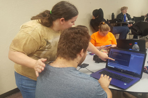 two people working together