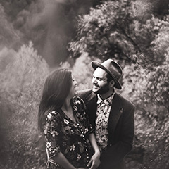 couple smiling, laughing holding each other