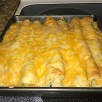 the enchiladas are all cooked and the cheese is melted on top
