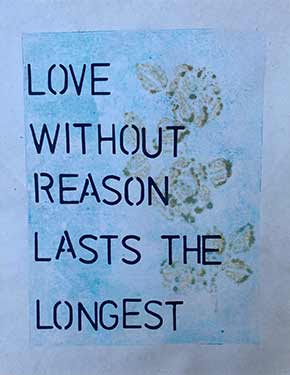 Print of gold roses with text 'love without reason lasts longest' on blue background.