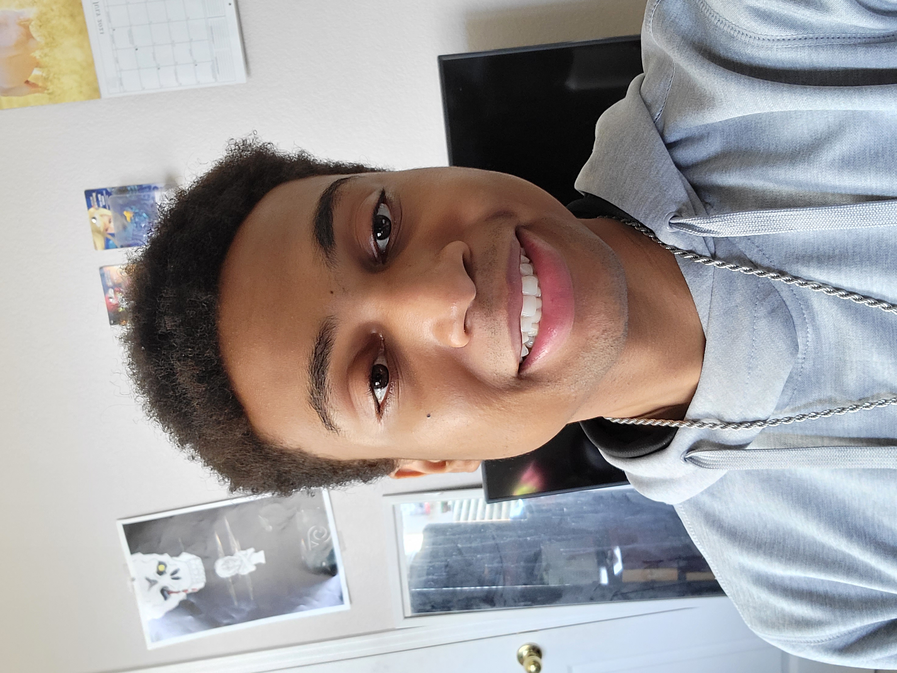 young man stares at camera