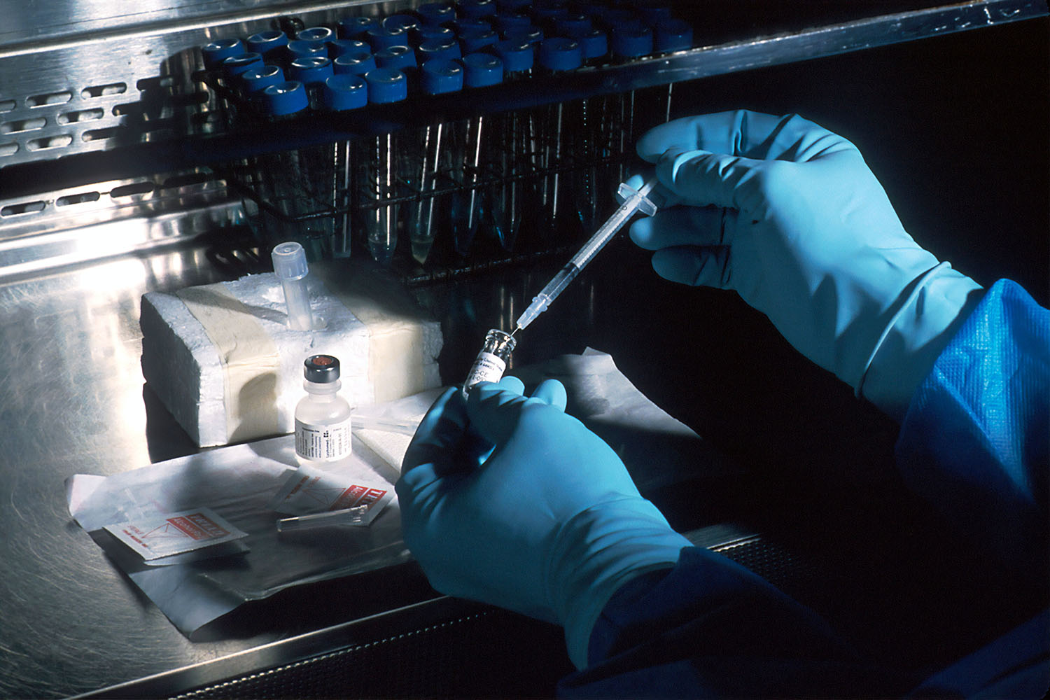 A scientist using medical equipment.