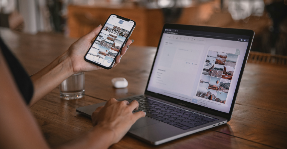 person with laptop and phone showing social media feed