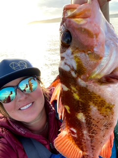 Picture of Erin holding a fish.