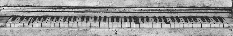 white piano with chipped keys
