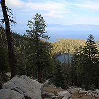 Small lake in the foreground and Lake Tahoe in the distance