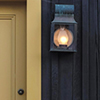 Close up of gold door and dark blue wall