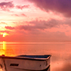 Boat on water during sunset