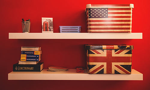 Close up of a red wall with shelves