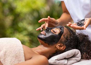 woman receiving facial