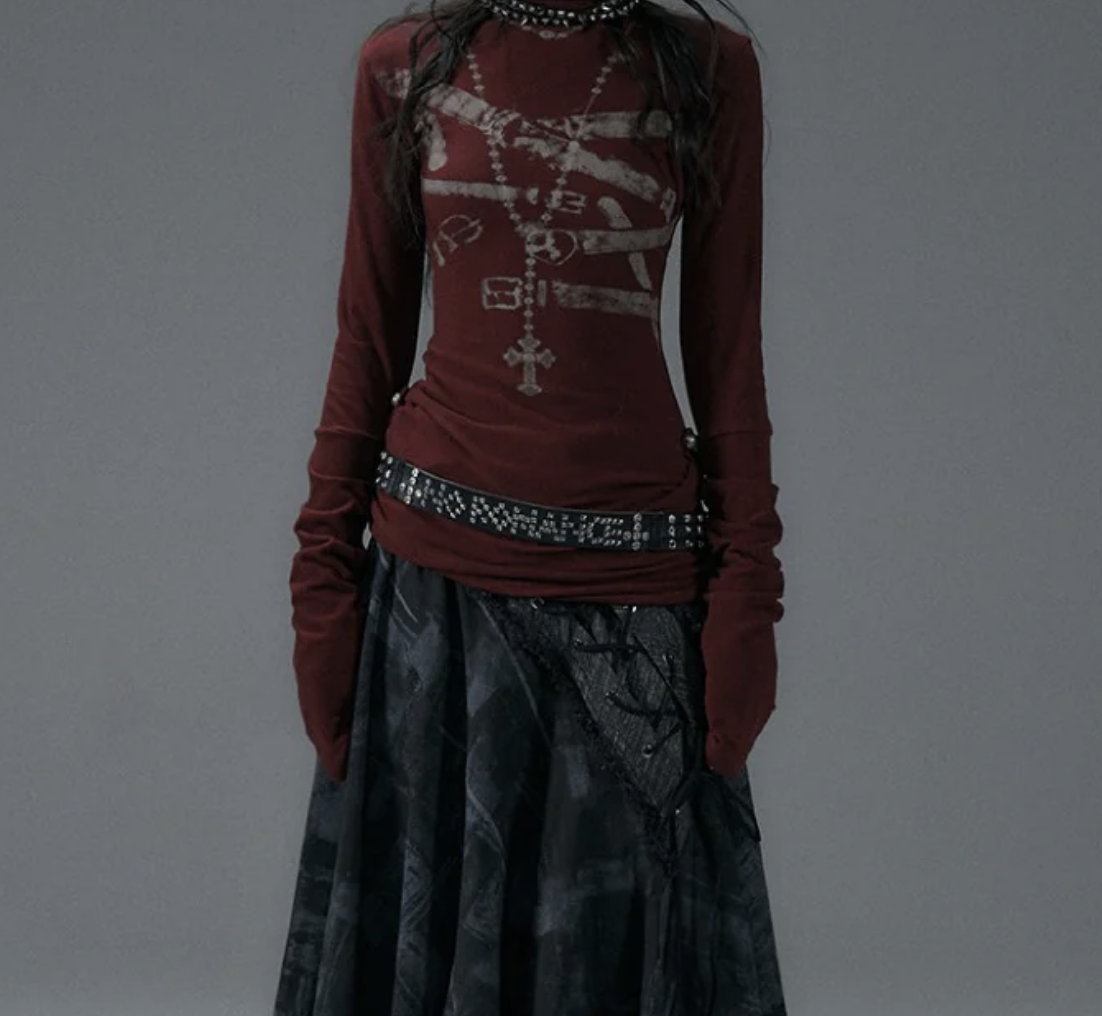 woman wearing long sleeve red shirt and plaid skirt