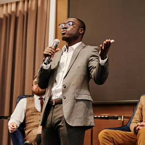 panelist speaking into microphone