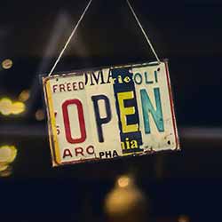 Open sign hanging in window